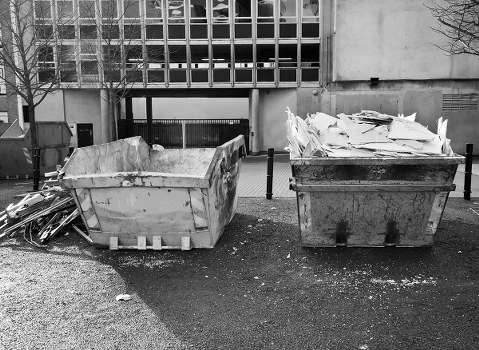 Construction workers managing waste on-site in Morden
